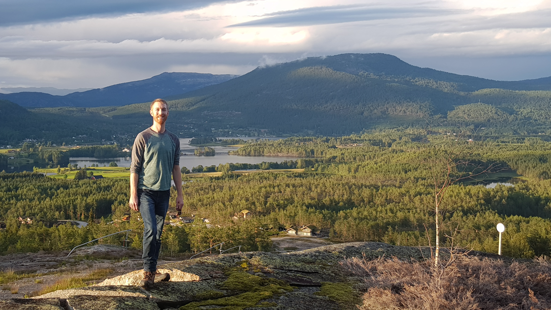 Mike Voellmecke, founder of Miljø og Vann AS standing on a mountain