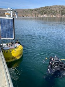 Diver entering Otsego Lake to deploy the cb-950 data buoy