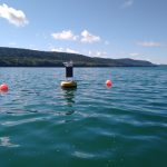 Data buoy in seemingly clean water, but the white foamy scum on the water surface contained high concentrations of cyanobacteria