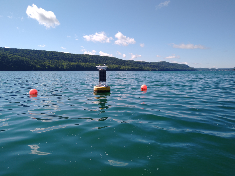 Data buoy in seemingly clean water, but the white foamy scum on the water surface contained high concentrations of cyanobacteria (MIcrocystis aeruginosa)