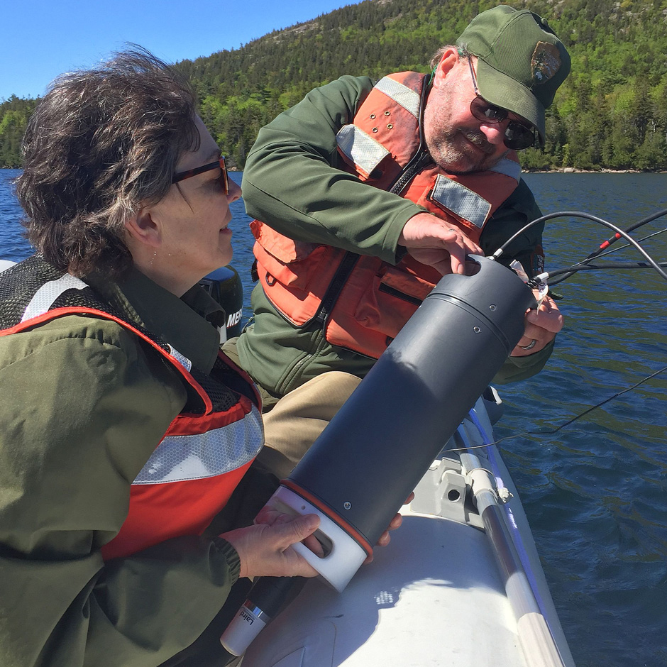 Acadia NP Resource Management Lead Rebecca Cole-Will and Air-Water Program Manager Bill Gawley prepare to install the NexSens SDL500 datalogger in the Jordan Pond high-resolution monitoring buoy.