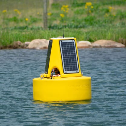 A NexSens XB-200 data buoy floating on the pond at the Fondriest Center for Environmental Studies.