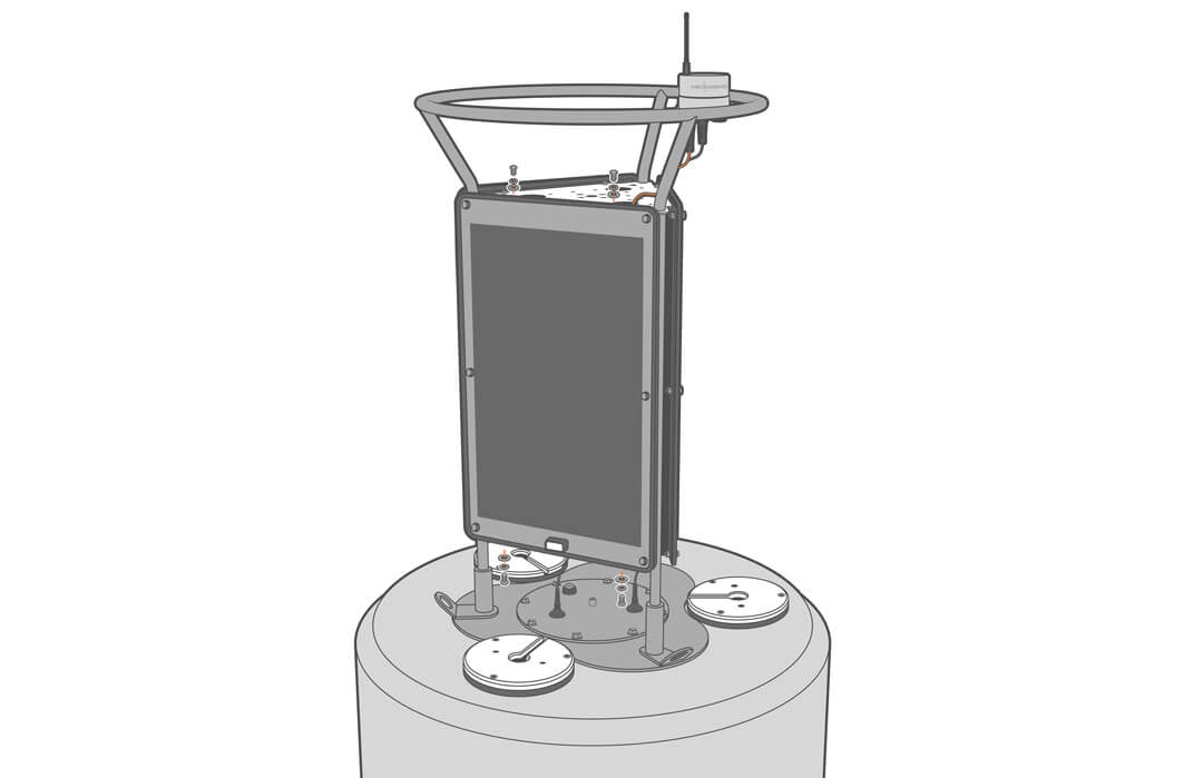 A NexSens large buoy solar panel being unscrewed from the solar tower. Four bolts, lock washers and flat washers are being installed--two on the top and two on the bottom.